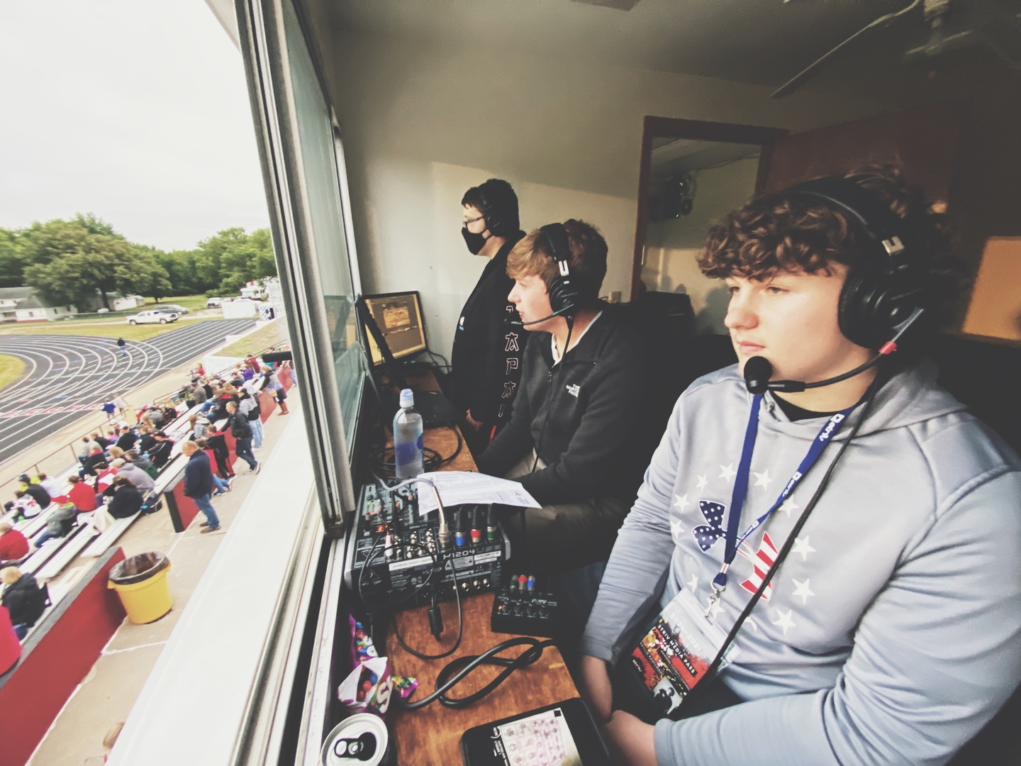 Striv crew members Cam, Sam, and Phil working a football game