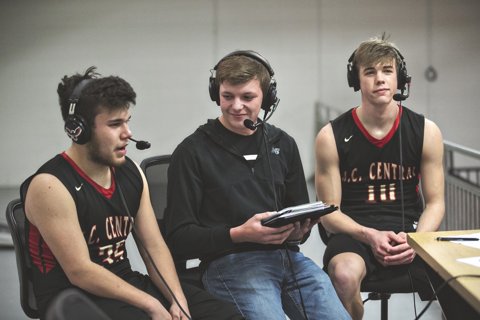 Sam interviewing senior boys basketball players