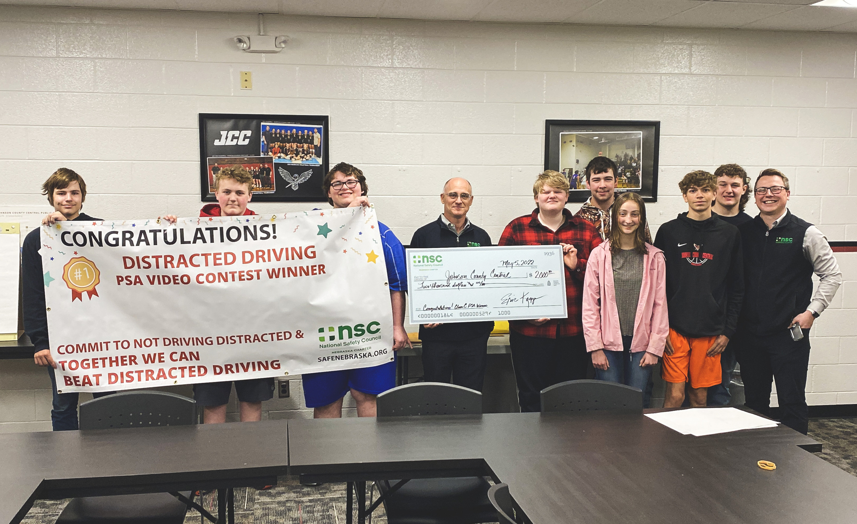 JCC Striv Crew accepting a banner and check from the National Safety Council - Nebraska Chapter