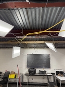 Main floor classroom with exposed ceiling.